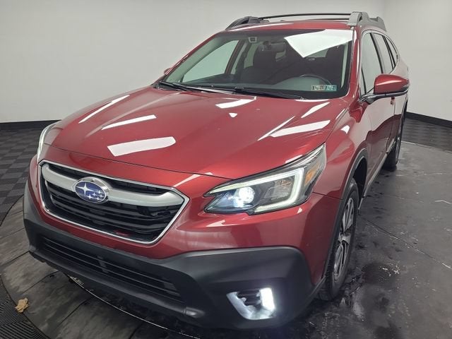 2021 Subaru Outback Premium in Red — front three-quarter view