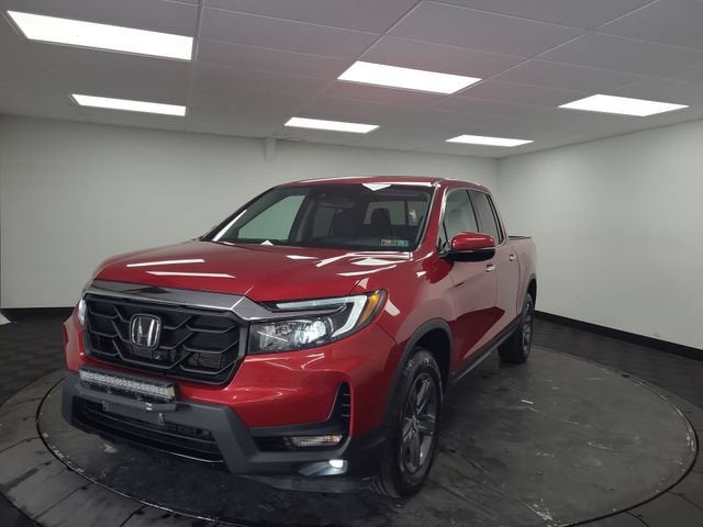 2023 Honda Ridgeline RTL-E in Red — front three-quarter view